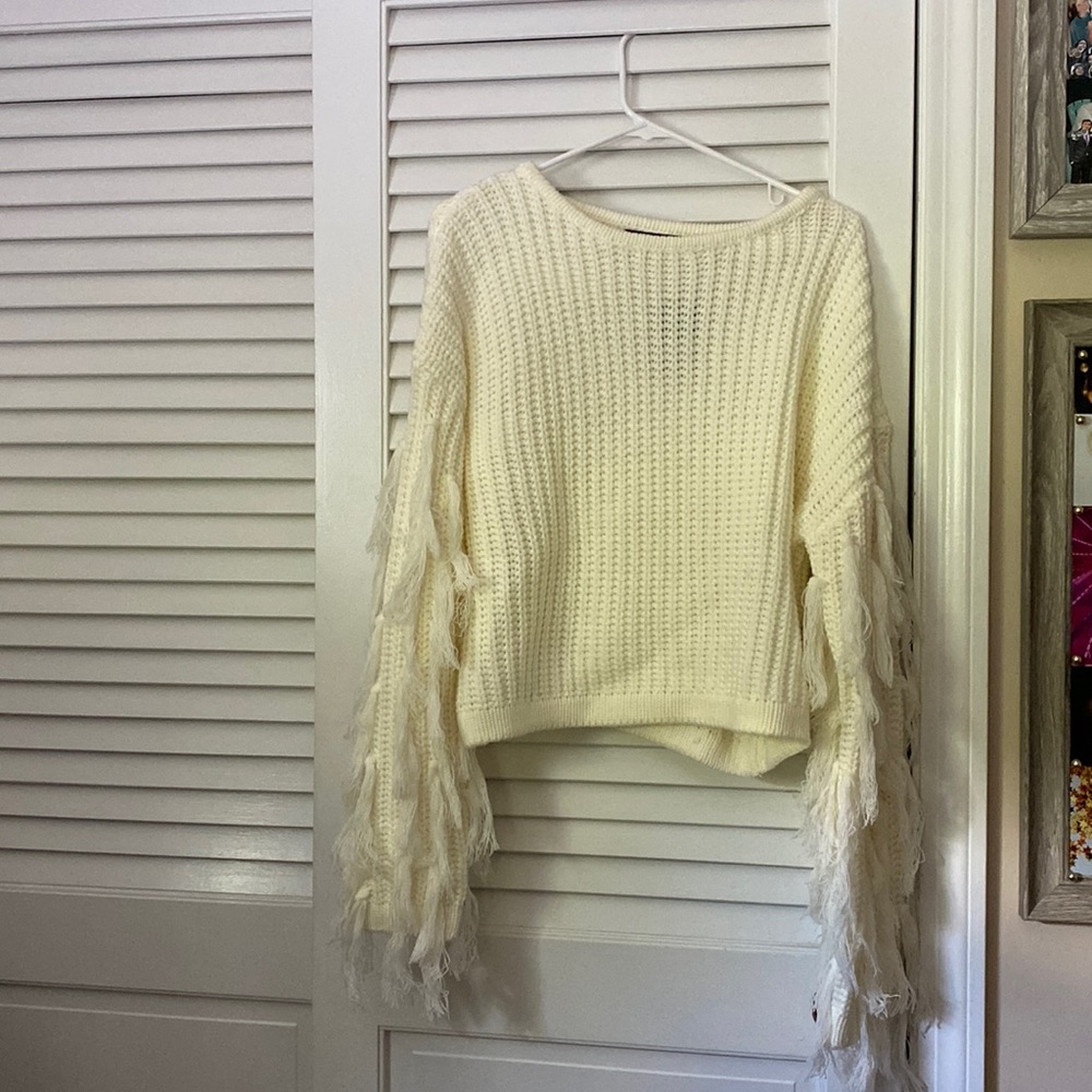 White cropped sweater with tassel sleeves